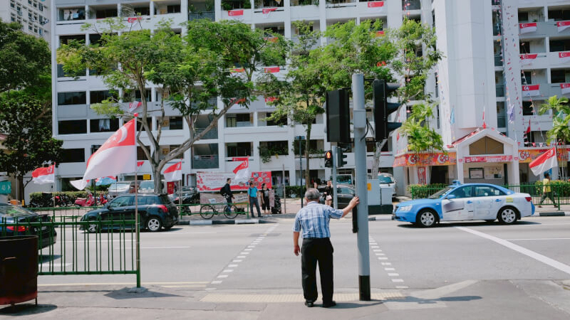 Uncle was waiting for the traffic light. 10 days left till the National Day